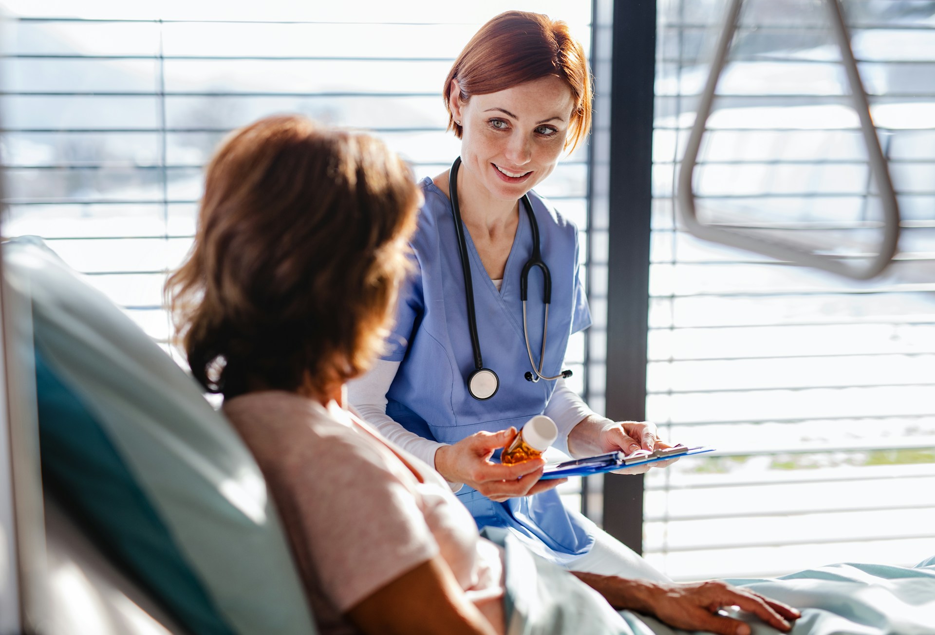 A friendly femaly doctorwith patient and medicine