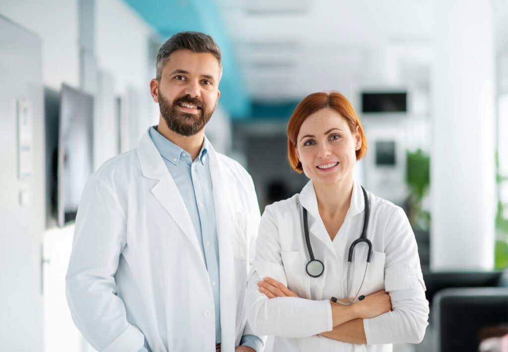 Two healthcare professionals in a hospital, representing collaboration, medication safety and clinical decision support.