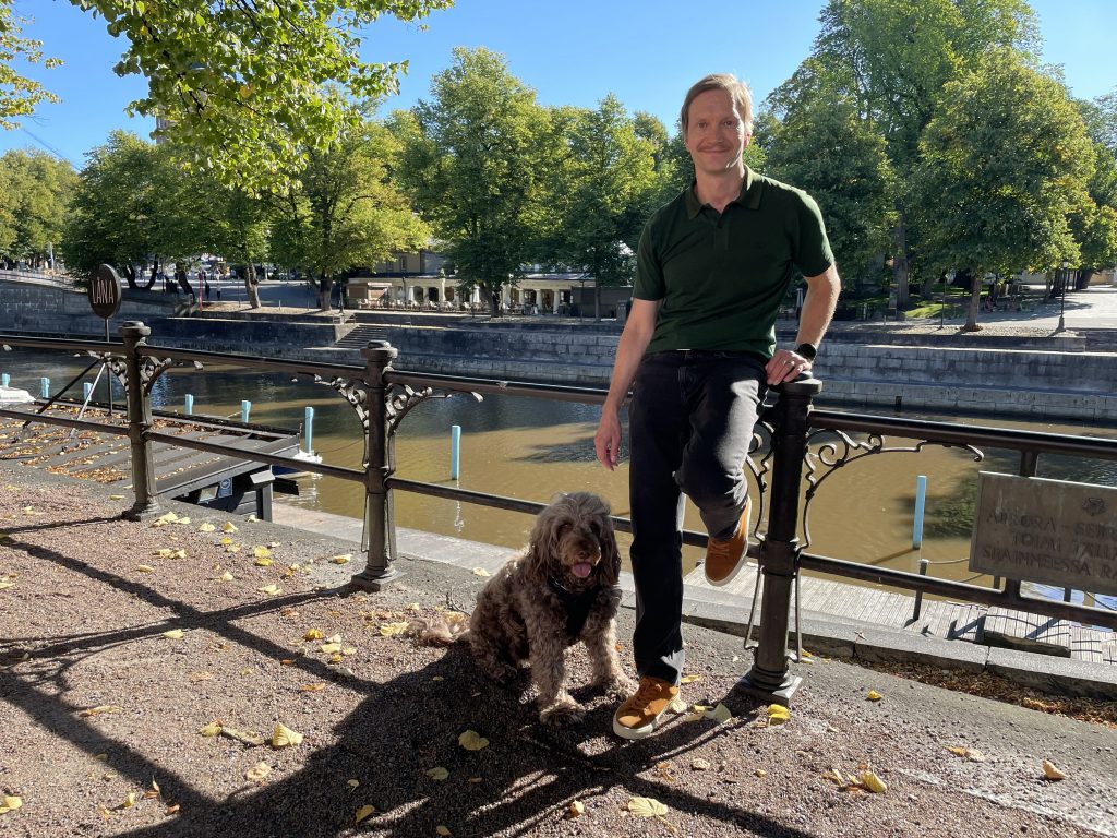 Jori Ruuskanen with his dog Fanni by the river Aura in Turku, Finland