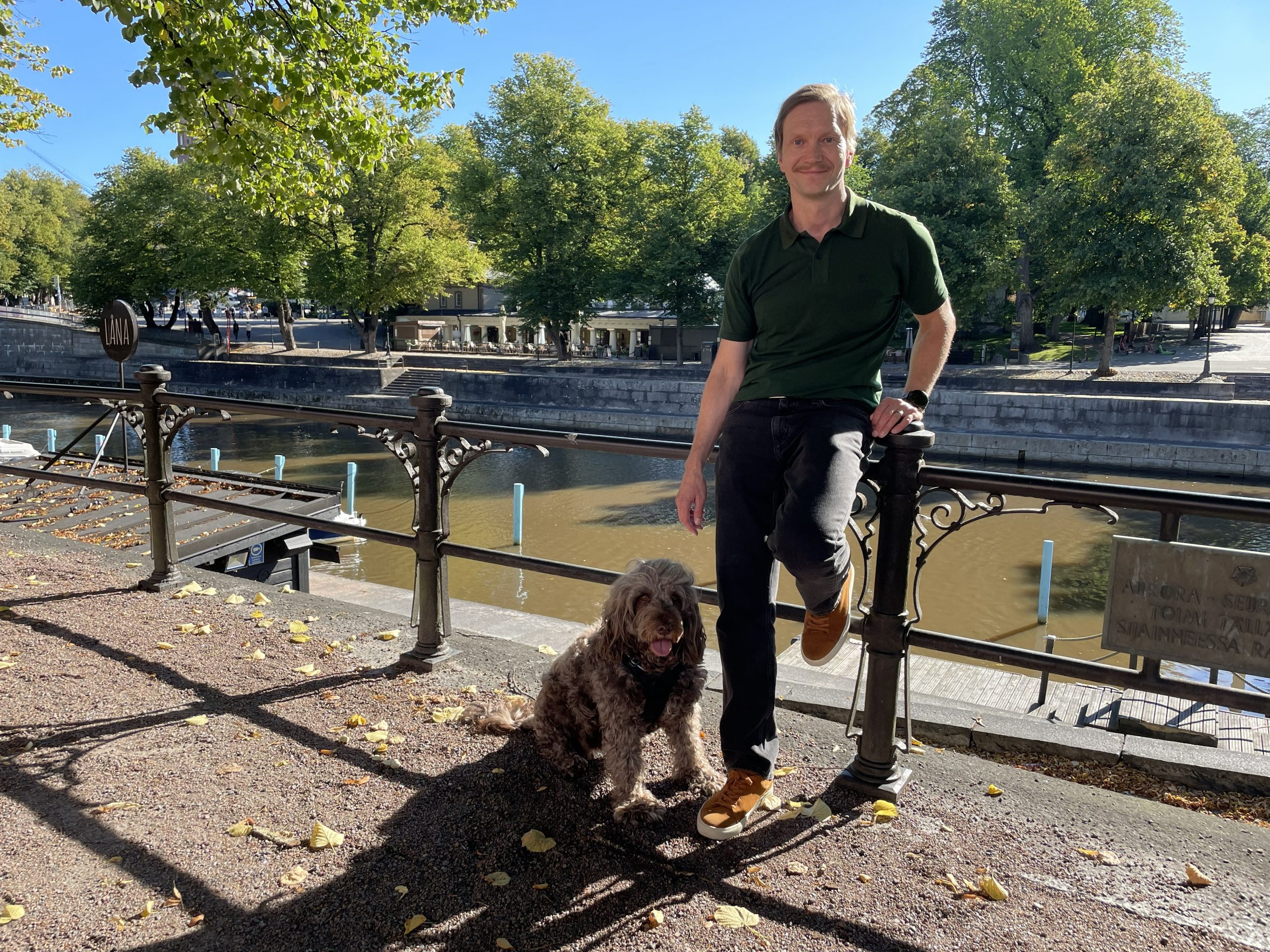 Jori Ruuskanen with his dog Fanni by the river Aura in Turku, Finland